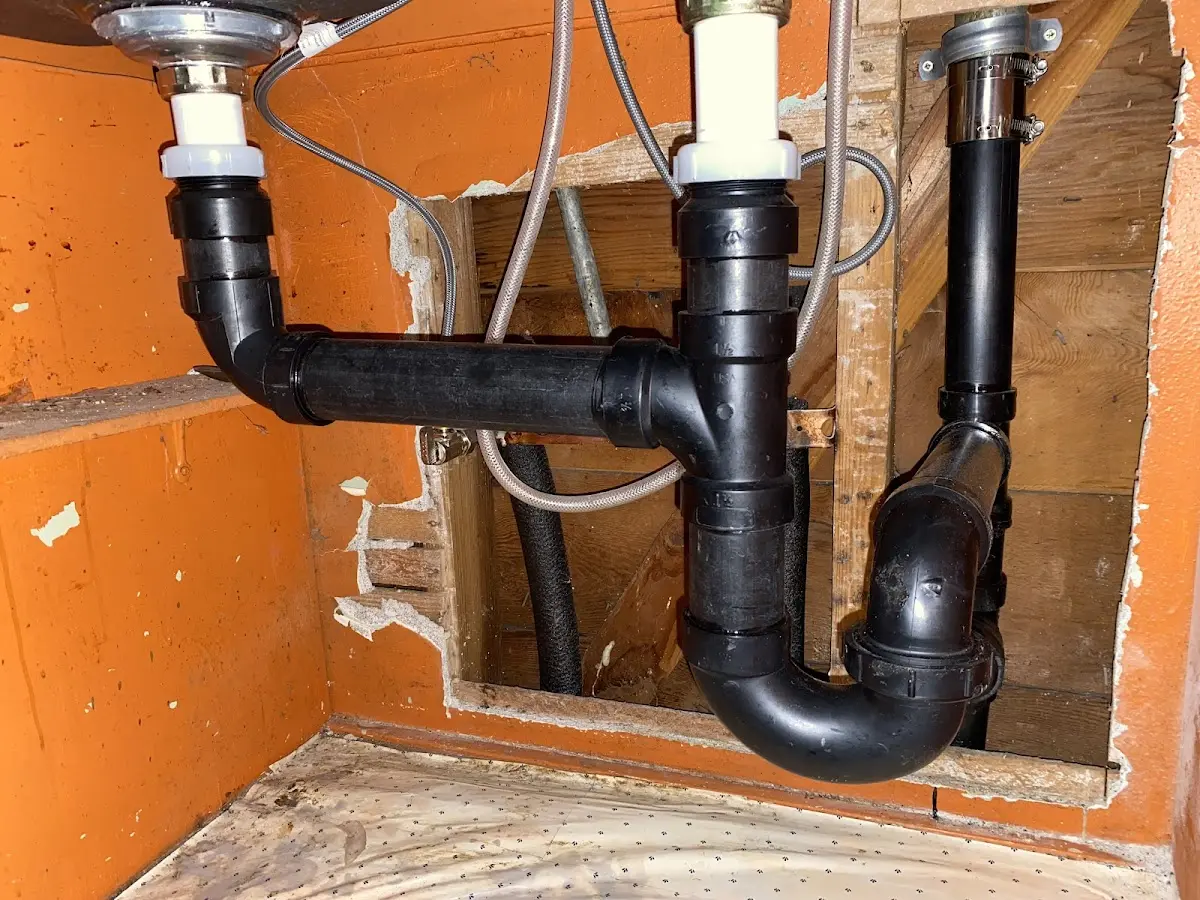 Professional Garbage Disposal Repair equipment and tools on the job in Canton